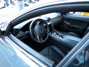 Interior photo of the Karma Revero showcases shifter and infotainment system