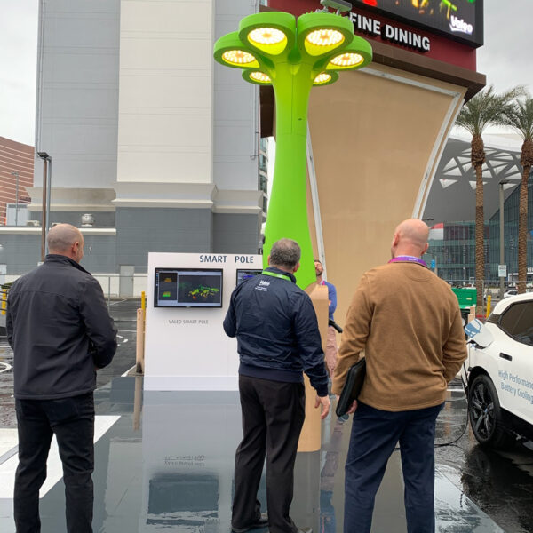 Brian Johnson with others examining a smart pole at CES.