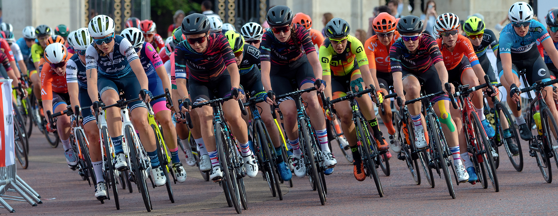 Cyclists in a group racing on the street.